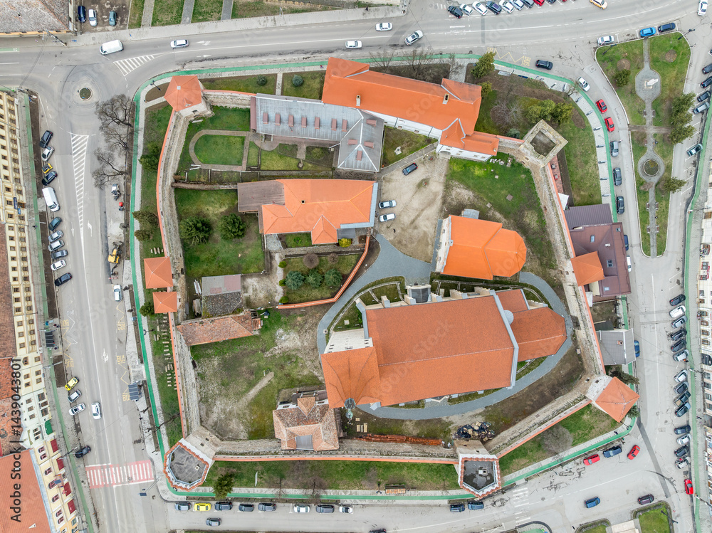 Aerial view of Aiud Nagyenyed fortified protestant church in Romania with walls and towers in the middle of the town