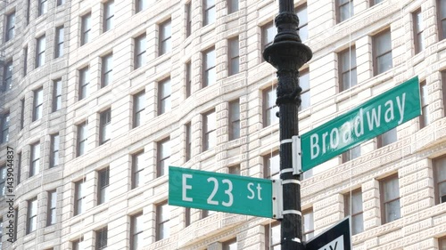 Broadway street road sign, Manhattan midtown district architecture, New York City corner. Traffic signage. Flatiron Building near Madison Square Park. Crossroad of 23 street, Bway and 5 Fifth avenue.