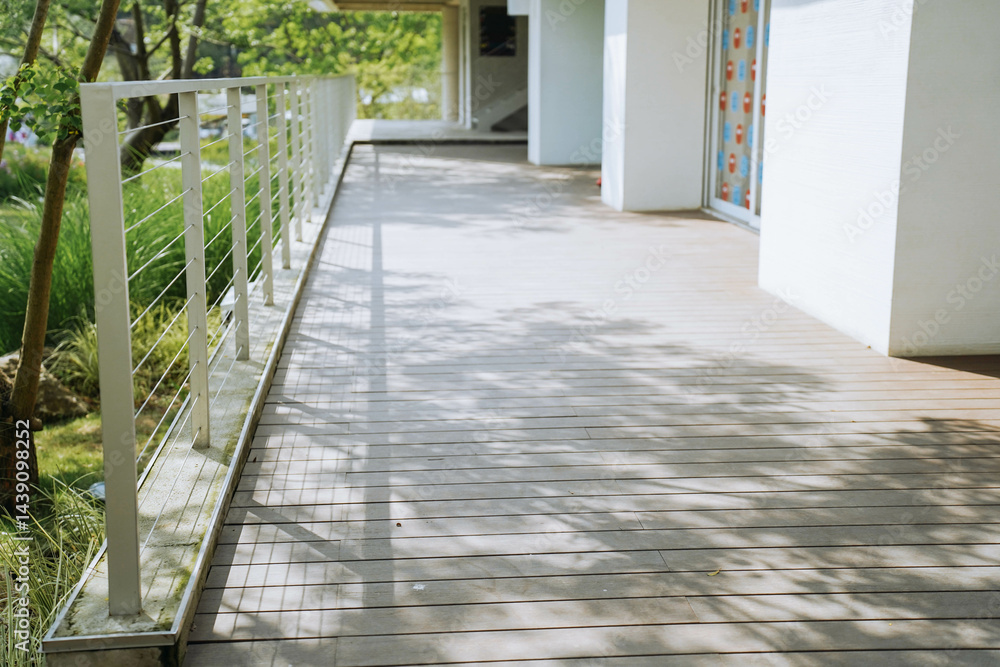 Stainless steel fence on outdoors corridor outside of building in modern style, perspective side view