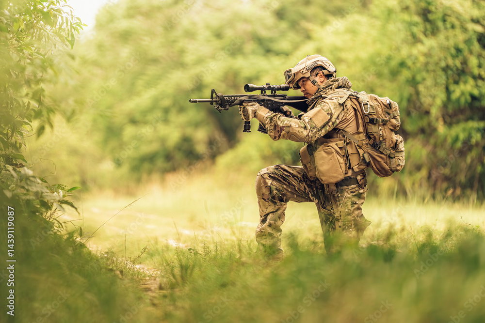 Amid the silence of the forest, a soldier takes a knee, holding his weapon firmly as he surveys the surroundings, perfectly blending into the natural environment with sharp awareness. Amid the silence of the forest, a soldier takes a knee, holding his weapon firmly as he surveys the surroundings, perfectly blending into the natural environment with sharp awareness.