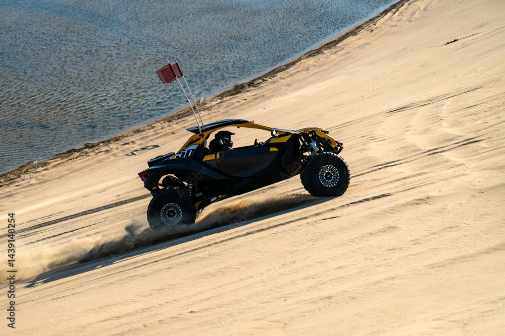 Doha, Qatar : Off road buggy car in sand dunes of the Qatari desert.