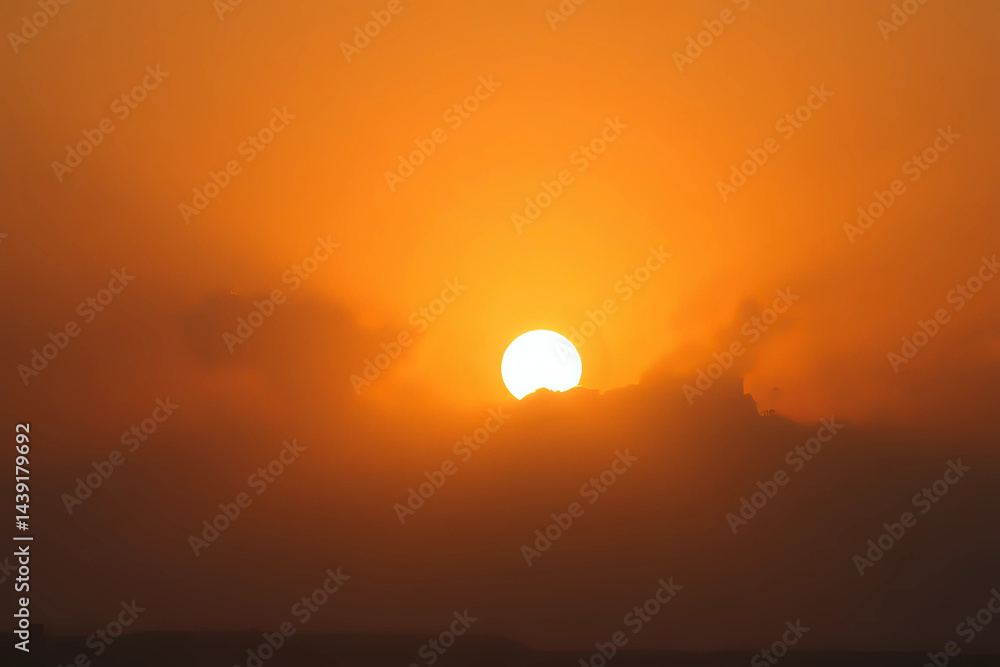 Orange sky with sun and clouds during hot summer weather. Orange sky with sun and clouds during hot summer weather.