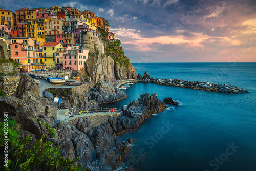 Obraz na płótnie Village with colorful seaside houses on the cliffs at sunset w salonie