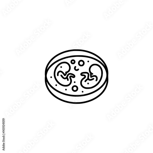 A simple line drawing of a petri dish containing two developing embryos or fetuses surrounded by small circles, possibly representing cells or nutrients.
