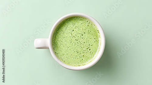 Obraz na płótnie Top-down close-up photo of a perfectly made matcha latte.
w salonie
