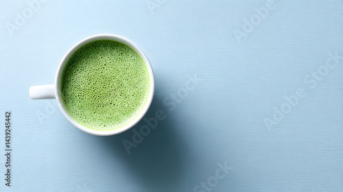 Top-down close-up photo of a perfectly made matcha latte.
