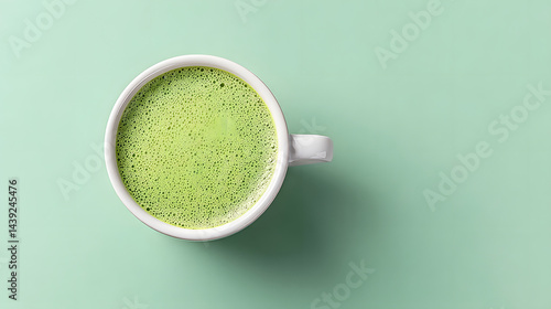 Obraz na płótnie Top-down close-up photo of a perfectly made matcha latte.
w salonie
