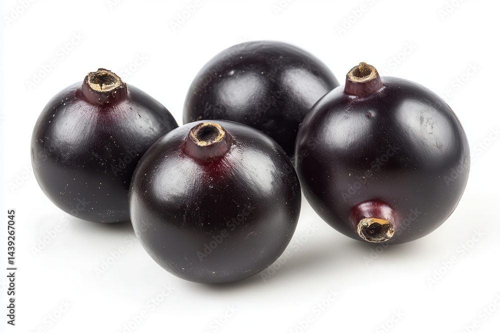 Fresh blackcurrants arranged on a white background, showcasing their shiny texture and natural color Fresh blackcurrants arranged on a white background, showcasing their shiny texture and natural color