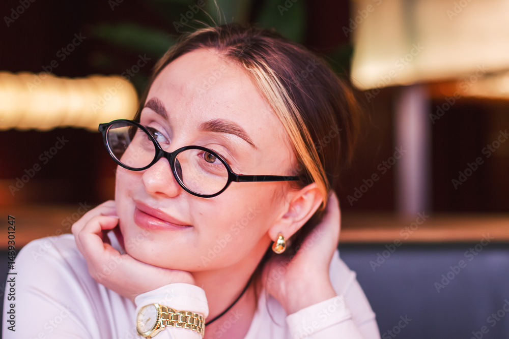 portrait of a young woman with glasses