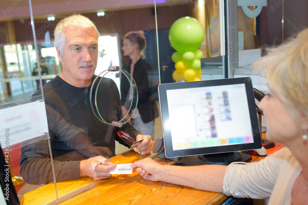 man holding or showing two cinema tickets booking ticket concept