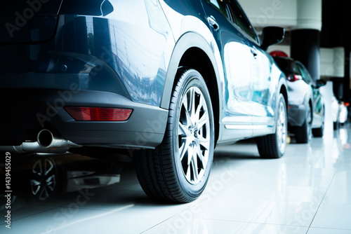 Obraz na płótnie Car parked in luxury showroom. Car dealership office. Car showroom business. New car parked in modern showroom. Auto for sale and rent business. Automobile leasing and insurance. Electric automobile. w salonie