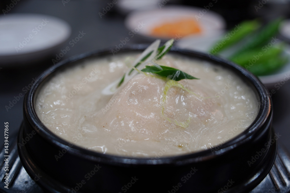 Samgyetang is a Korean soup of chicken stuffed with rice and ginseng, served in a hot broth Samgyetang is a Korean soup of chicken stuffed with rice and ginseng, served in a hot broth