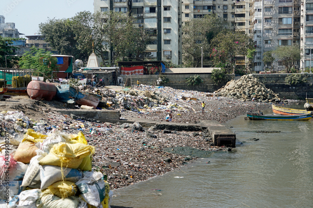 garbage dump in a fisherman district in mumbai