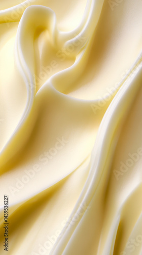 Obraz na płótnie Butter cream texture with smooth, wavy patterns highlighted by soft lighting in a close-up view w salonie