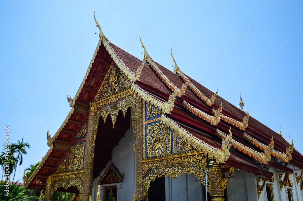 Fototapeta premium Golden Pagoda and Chapel, Lanna Architecture, Symbols of Buddhism, South East Asia at Wat Phra Singh Woramahaviharn, Chiang Mai, Northern Thailand