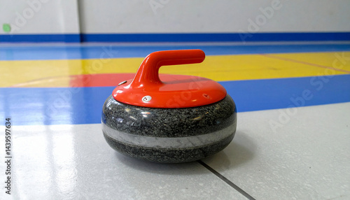 Close up of a curling granite glide stone on a curling ice background