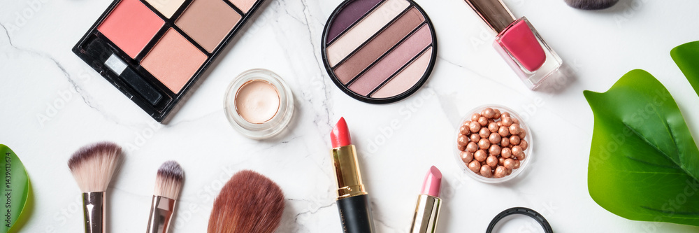 Cosmetic products on white background. Web banner format with space for design.