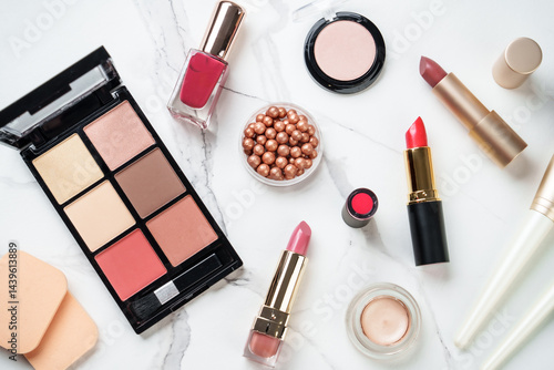 Make up products at white background. Cosmetic palette, brushes, mascara and lipsticks. Flat lay.