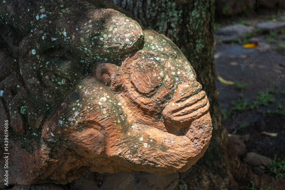 Stone tiki statue in Atuona, Hiva Oa, Marquesas Islands, French Polynesia