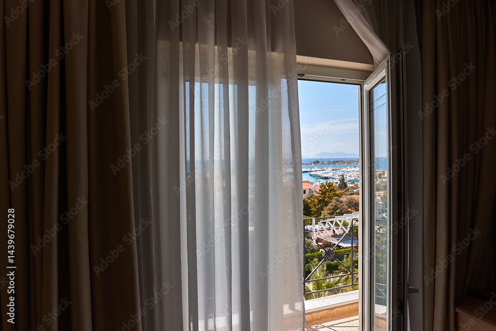 Apartment with sea view, open balcony door
