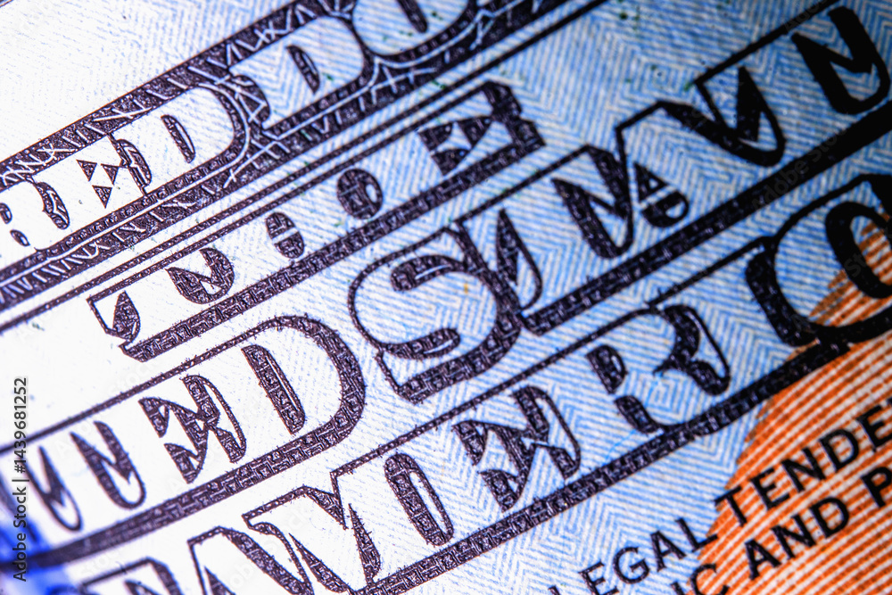 Macro image of one hundred US Dollar bill with description: THE UNITED STATE OF AMERICA High resolution photo. Macro image of one hundred US Dollar bill with description: THE UNITED STATE OF AMERICA High resolution photo.