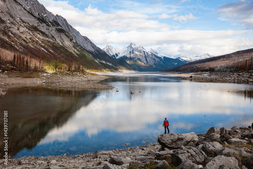 Man at Medicine lake in autumn, Jasper, Canada