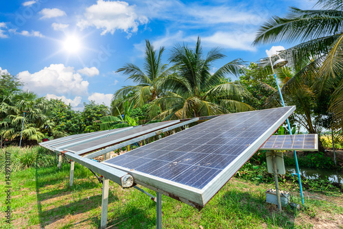 photovoltaic solar power panel for agriculture in a rural houses area Agricultural fields blue sky background,Agro-industry of household Rural style in Thailand, smart farm alternative clean energy.