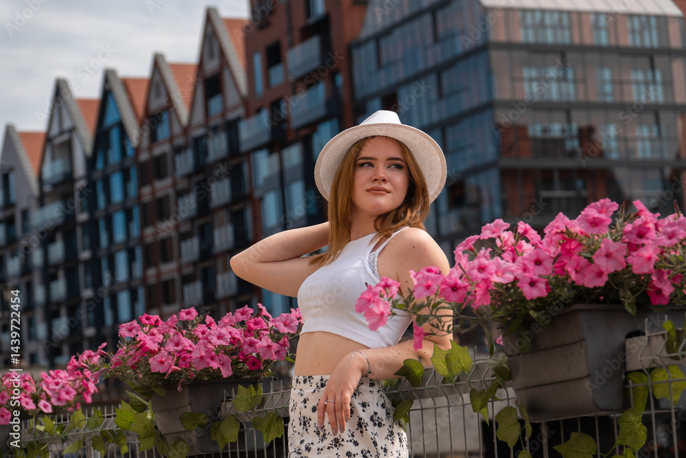 girl in a white hat on the background of the city of Gdansk Poland Europe