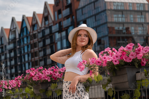Obraz na płótnie girl in a white hat on the background of the city of Gdansk Poland Europe w salonie