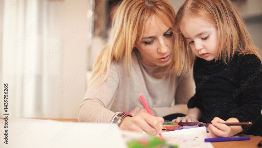 Fototapeta premium Family at home. Shallow DOF. Developed from RAW; retouched with special care and attention; Small amount of grain added for best final impression. 16 bit Adobe RGB color profile.
