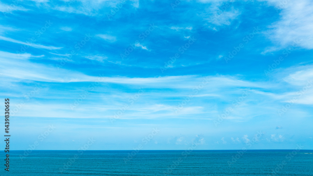 Fototapeta premium Nature of the beach and sea Summer with sunshine, sandy beaches, clear blue waters sparkling against the blue sky. On an island with good ecology and environment Background for summer vacation