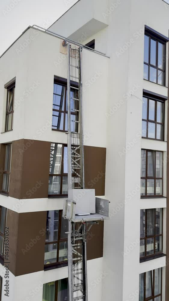 Exterior furniture elevator lifting platform to high building window