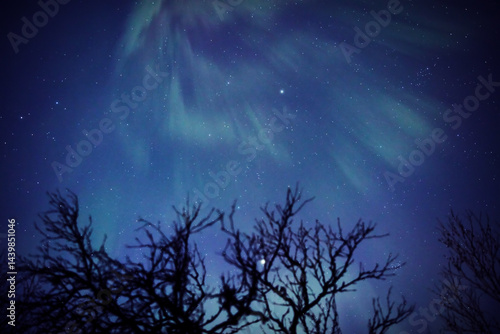 Obraz na płótnie Aurora borealis, polar lights with Milky Way stars. w salonie