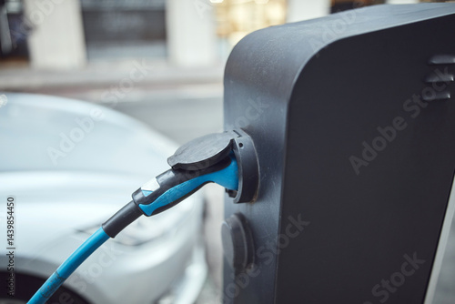 Obraz na płótnie Charging electric vehicle on a public charger. w salonie