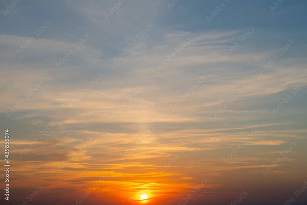 Background with sky at sunset. Red sun sets over the horizon. Background with sky at sunset. Red sun sets over the horizon.
