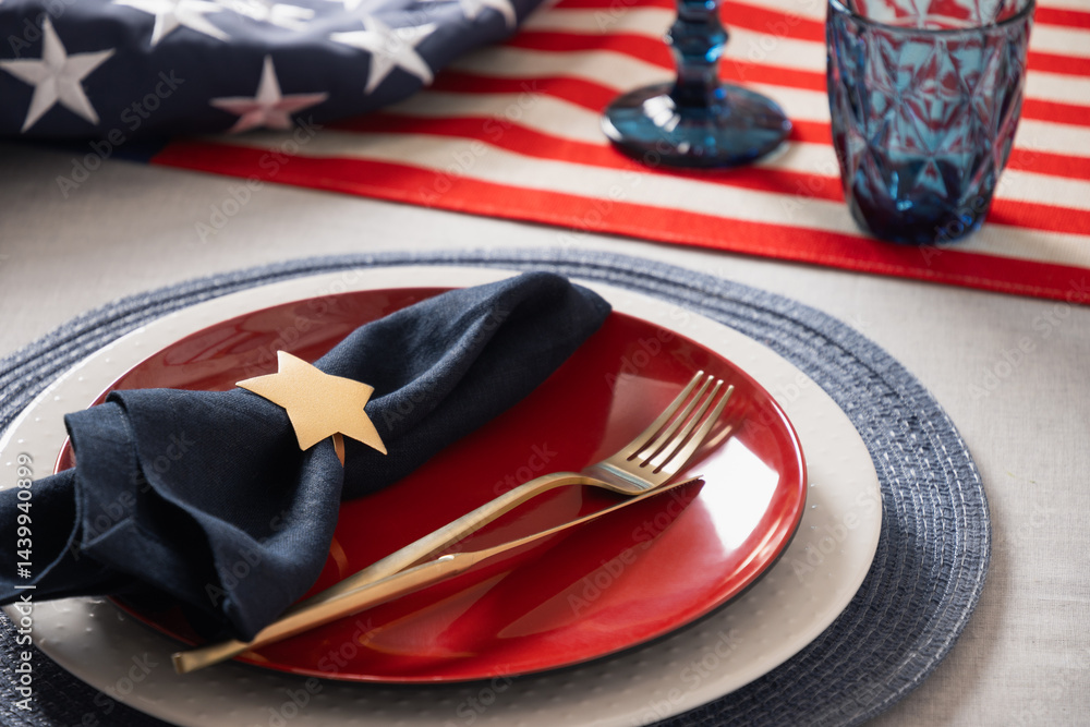 American table setting for USA Independence Day. Festive dinner decorated in USA national flag colors white, red and blue. Close up. Copy space.