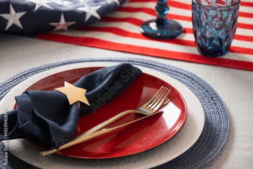 Obraz na płótnie American table setting for USA Independence Day. Festive dinner decorated in USA national flag colors white, red and blue. Close up. Copy space. w salonie