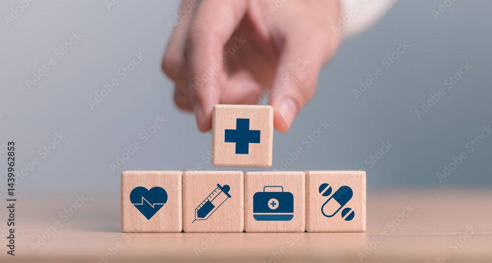 Tacking wooden blocks with healthcare icons, Health insurance health concept. Building a strong health system. Digital health innovation and the future of smart medical services through technology.