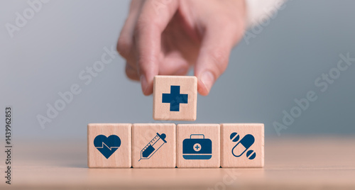 Obraz na płótnie Tacking wooden blocks with healthcare icons, Health insurance health concept. Building a strong health system. Digital health innovation and the future of smart medical services through technology. w salonie