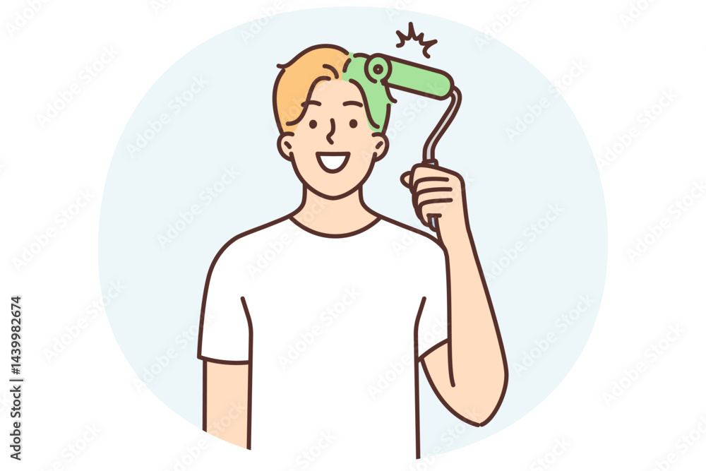 Man uses paint roller to dye hair green and looks at screen smiling for concept renovation in house Man uses paint roller to dye hair green and looks at screen smiling for concept renovation in house