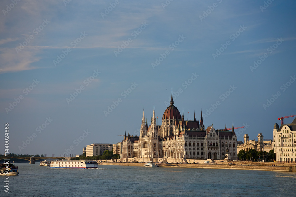 Hungarian Parliament Building in Budapest at sunset with reflection in Danube River. Neo Gothic architecture and famous landmark of Hungary