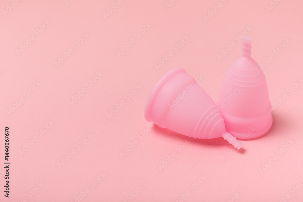 Menstrual cup on a bright background. Sanitary napkins, tampons and menstrual cup.Concept of critical days, menstruation.feminine hygiene product. Women health concept.Premenstrual syndrome.Copy space