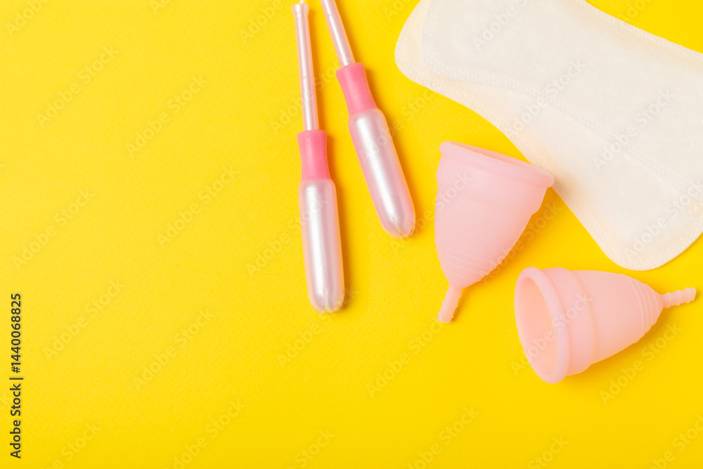 Menstrual cup on a bright background. Sanitary napkins, tampons and menstrual cup.Concept of critical days, menstruation.feminine hygiene product. Women health concept.Premenstrual syndrome.Copy space