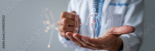 Medical professional holding holographic body image.