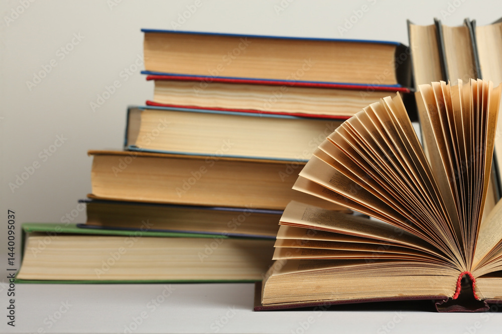 Obraz premium Open book, hardback colorful books on table. Back to school. Copy space for text. Education business concept