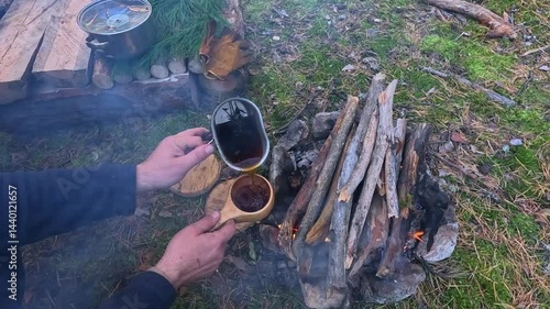 Making a drink on a fire in the forest. Tea. Coffee on the fire.