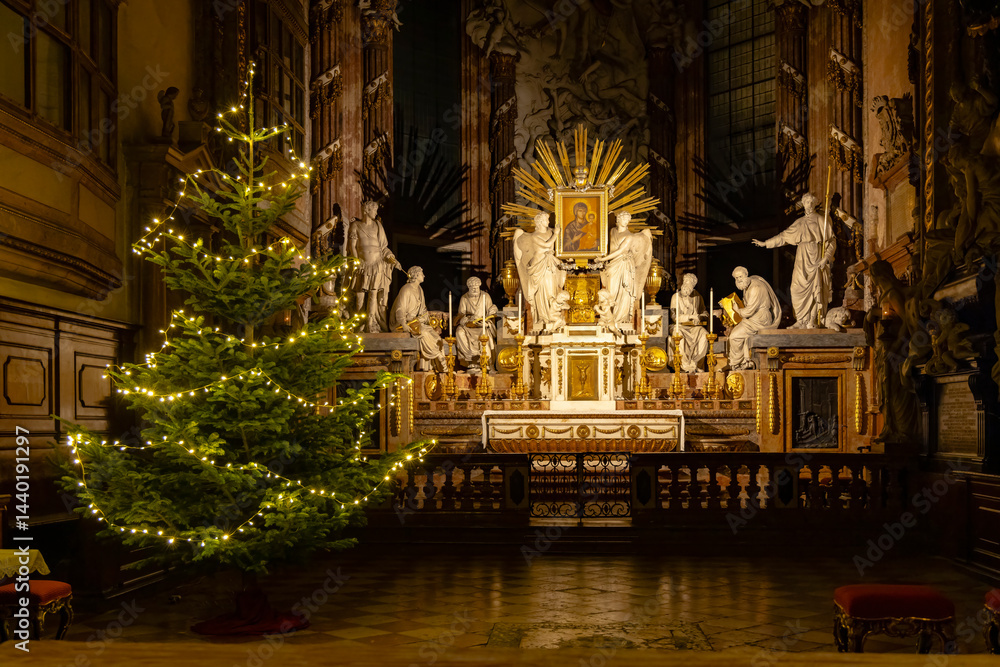 Christmas tree illuminating a baroque altar inside a church