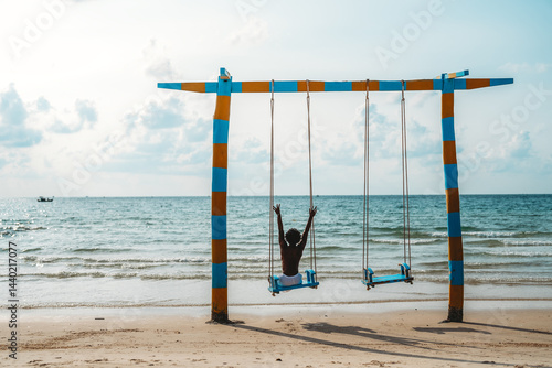 Obraz na płótnie Man enjoys a peaceful moment of solitude on a beach swing, embracing self-reflection and mindfulness w salonie