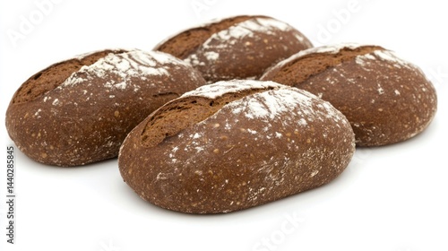 Four dark brown loaves of bread on white background