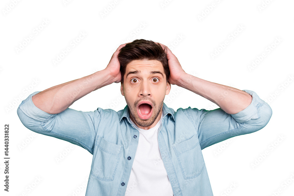 Photo of crazy horrified fearful man holding his head after having known the worst news in the world with bristle isolated over green vivid color background Photo of crazy horrified fearful man holding his head after having known the worst news in the world with bristle isolated over green vivid color background